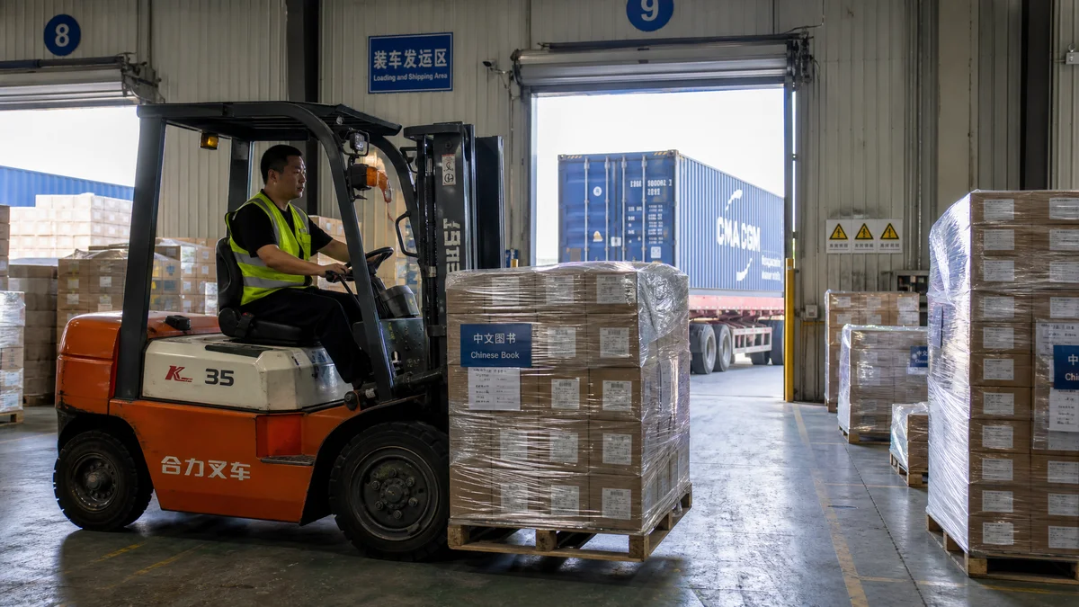 Palletized books ready for shipping at a book printing china factory warehouse with sea freight containers