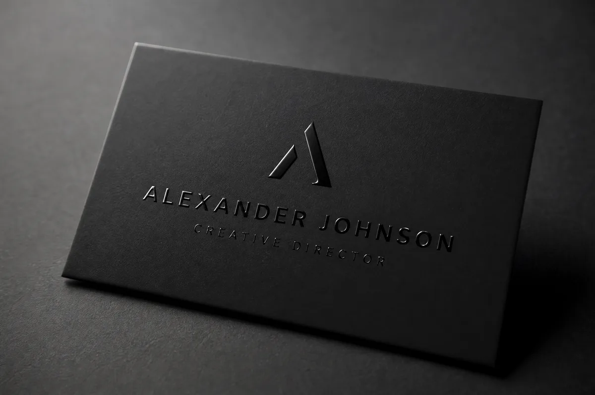 Premium business card with spot UV glossy text on matte black cardstock