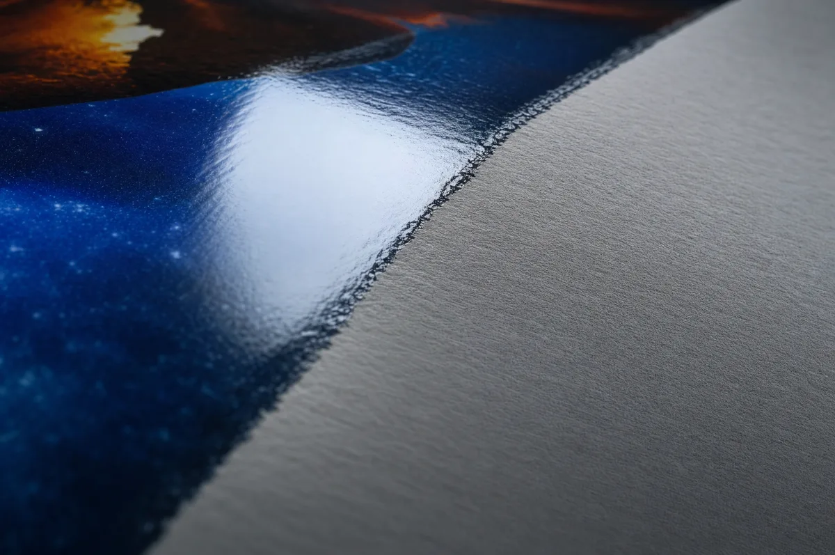 Close-up of a UV-coated printed surface showing the glossy protective layer reflecting light