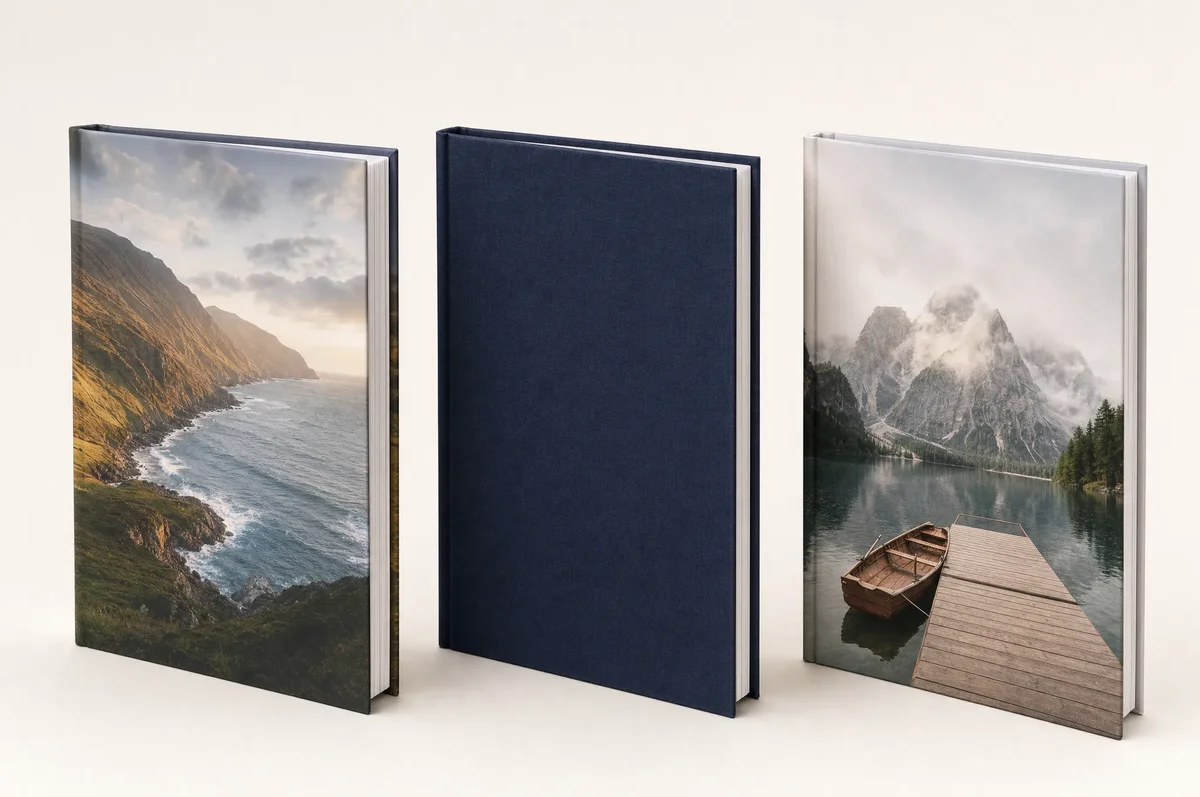 Three photo book covers displayed side by side: printed hardcover with dust jacket, linen cover with gold foil stamping, and photo-wrap hardcover with full-bleed image